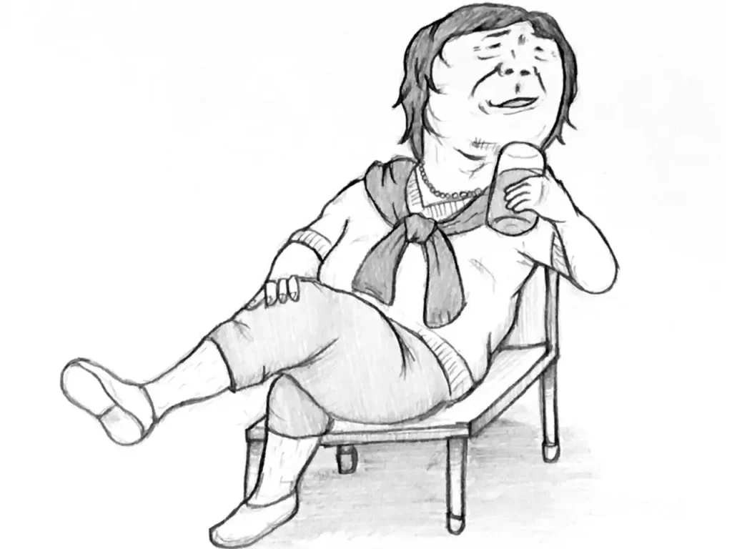 椅子に座って飲み物を飲んでる男性